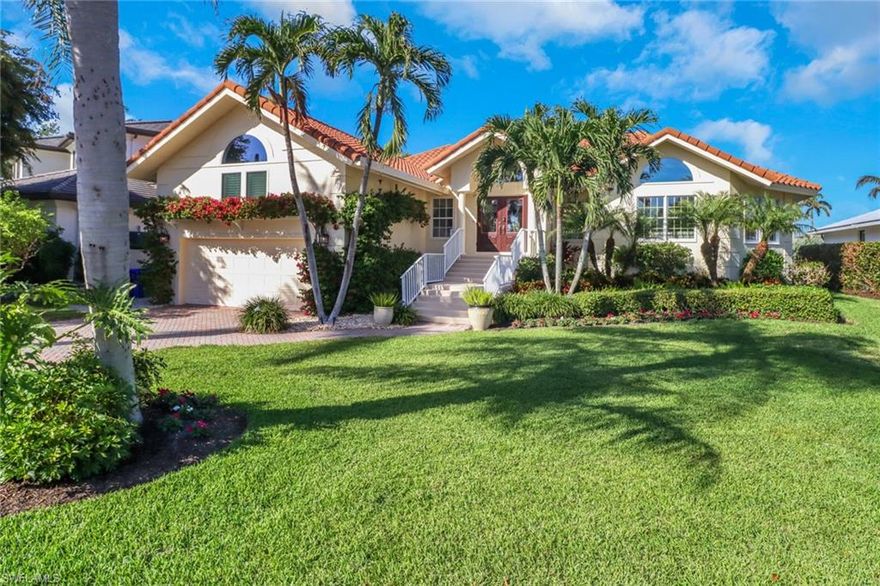 Welcome to 1275 Cobia Court in the very desirable waterfront community of Royal Harbor, just minutes from downtown Naples. This 3 bedroom, 3 bathroom pool home is ideally situated on one of the best cul-de-sacs. Upon entering the foyer, you will immediately notice the large screened pool lanai and unique architectural volume ceilings. The living room / dining room is very spacious and perfect for large gatherings. The kitchen and family room provides an additional entertaining space. In addition, there is an extra open area for an office, bar, or a sitting area. This home is perfect to move right in or if you want to renovate, the elevation is above the FEMA requirements, therefore the 50% City of Naples rule for renovations does not apply...so you can make this place even more fabulous than what it already offers. A new dock and 28,000 lb. lift with a 12-13ft beam that can accommodate a large boat was installed in 2023. Just a quick boat ride to the Naples Bay and Gulf of Mexico with no bridges. Make your appointment today to view this spectacular home in person!