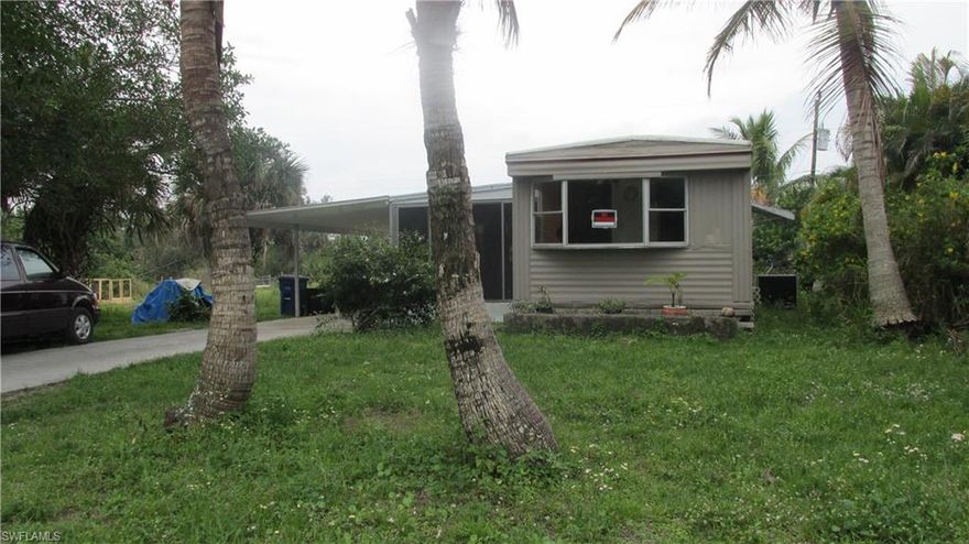 2/1 home with large workshop/laundry room, large closed lanai and carport. Located on the end of a dead end road. Great for handy man or a starter home.