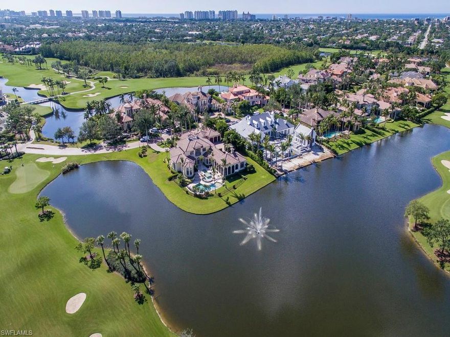 H.12139 - Magnificent, custom estate located in the highly desired Estates at Bay Colony that offers luxury & tranquility in equal measure. Strategically situated with 387’ of beautiful lakefront vistas & a commanding view of the in-lake fountain from the grand foyer entrance. The home sprawls throughout its 7,111 Sq.ft of living area with a gracefully flowing floorplan that is warm, inviting & enjoys plentiful amounts of natural light. Exquisite finish & features includes marble floors, beautiful millwork & stonework, custom ceiling detail, in-door & out-door fireplaces, butler’s pantry, climate controlled walk-in wine room, elevator, gourmet kitchen and much more! Master Suite includes sitting room, his/her baths & his/her walk-in closets.  Separate guest suite located off the covered lanai is ideal for staying family/friends or just as a bonus room. There is ample motercourt space framed by dual 2-car garages, allowing for the avid car collector.  This home is the entertainer’s dream with 31’ x 32’ screened lanai with summer kitchen & fireplace as well as the resort styled custom pool/spa with lakefront vistas.  Ideally situated nearby the clubhouse & private beach & tennis club