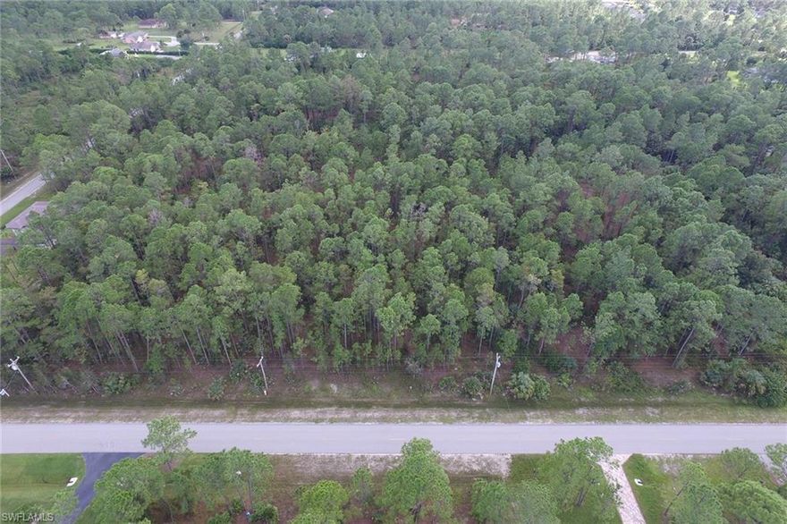 Beautiful two-plus acre of land  near Immokalee Road so you  have quick access to Immokalee Road for shopping and work. This property is slated to have a bridge on it in the next several years which will be built over the canal providing additional access routes to this land, ideal for a nice home.