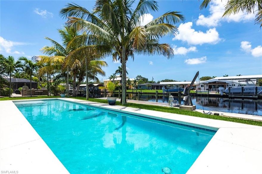 Welcome to your dream waterfront retreat! This move-in ready, direct sailboat access pool home offers 100 feet of seawall, dock power for larger boats, and working davits?just minutes from open water. Recently upgraded, the home features HIGH IMPACT Doors and windows, new granite countertops, stainless appliances, solid surface flooring, and beautifully renovated bathrooms. The solar panels offer outstanding energy savings, while the newly constructed lap pool provides a private space for fitness and relaxation. Brand new sod enhances the curb appeal, setting the stage for lush Florida living. The split-bedroom layout includes a spacious master suite with walk-in closet and ensuite bath, an eat-in kitchen with breakfast bar, and light-filled living and dining areas. NO HOA restrictions!  Located in a peaceful, non-gated community close to beaches, top-rated schools, shopping, and dining. Whether you're looking for a personal paradise or an income-generating investment, this affordable waterfront gem checks all the boxes. ROOF is 2018 & HVAC is 2020.