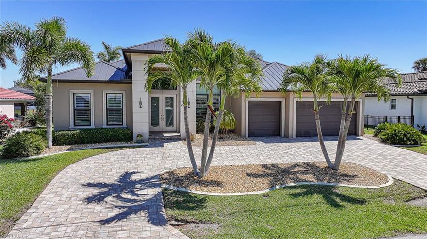 Welcome to an exceptional waterfront retreat in the highly sought-after community of Punta Gorda Isles! This stunning 3 bedroom PLUS den, 3 bath residence offers over 2,700 square feet of refined living space, where elegance, comfort, and coastal sophistication come together seamlessly. From the moment you step inside, you’re greeted by an expansive open-concept design, soaring ceilings, and an abundance of natural light that highlights the home’s upscale finishes and thoughtful details. The spacious living areas flow effortlessly, creating the perfect setting for both intimate gatherings and grand entertaining. The sliding doors open up to seamlessly connect indoor and outdoor living, while offering breathtaking waterfront views, bringing the beauty of Southwest Florida right into your home. The gourmet kitchen is a true centerpiece, featuring an abundance of cabinetry, quartz countertops, a large center island, soft-close drawers, and convenient pull-out shelving. A dinette area overlooks the water offering the perfect spot for casual dining. There is also a formal dining room with  gorgeous tray ceilings offering a more elegant setting. The luxurious primary suite is a private sanctuary with direct lanai access, two walk-in closets, and a spa-inspired bathroom complete with dual vanities, a soaking tub, and a walk-in shower. There are two additional bedrooms for guests; one features an ensuite bathroom. There is also a third full bathroom with lanai access for easy clean up after spending time in the pool/spa or on the boat! The versatile den provides an ideal space for a home office or quiet retreat. Step outside to your private oasis where a heated saltwater pool and spa await, all set against serene waterfront views. Additional highlights include a well-appointed laundry room with a utility sink and added shelving, as well as a new roof. The three car garage offers plenty of room for your cars, golf cart, & hobbies. The spacious lanai is designed for relaxation and entertaining, capturing the essence of Florida living. Enjoy boating? You are only steps away from your extended concrete dock and boat lift, offering quick powerboat access out to Charlotte Harbor and beyond to the Gulf of Mexico. Just minutes from dining, shopping, golf, Fishermen's Village, and historic downtown Punta Gorda, this residence offers the perfect balance of privacy and convenience.