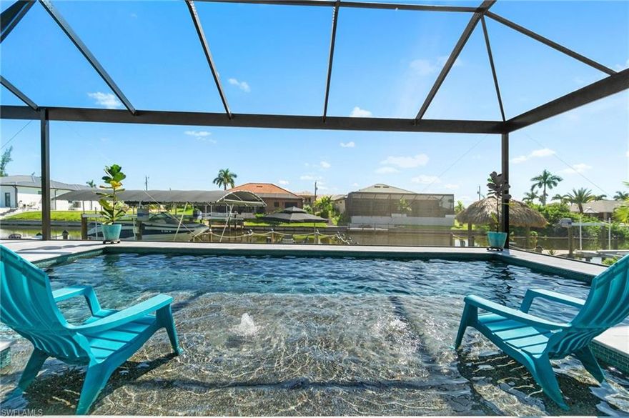 Welcome to your own slice of paradise! This stunning custom-built 2021 3 bed + Den 3 bath 3 car garage home w/city water & sewer is the perfect place to enjoy all the beauty Southwest Florida has to offer. Enjoy a heated saltwater pool with marble pool deck or take advantage of gulf access from your self-leveling 10,000 lbs. boat lift w/canopy cover. The homeowner put in extra touches like hurricane windows & doors for extra protection plus 90-degree pocket sliders for an unobstructed view, spray foam insulation throughout the entire attic & garage for energy efficiency & double ovens in the kitchen that has granite countertops & tile flooring throughout. You'll love the 12 ft ceilings with 14 ft coffered tray ceilings in the living room plus 8 ft doors with banded window coverings that can be controlled by remote. Each bedroom has its own bathroom, & the 3rd bath doubles as your pool bath. The outdoor space is equally amazing - enjoy plenty of covered seating as well as an outdoor kitchen when entertaining guests while taking in those amazing views through panoramic screens. Plus it's only 1 bridge (9ft Clearance) away from open water where it's only 25 min ride away!