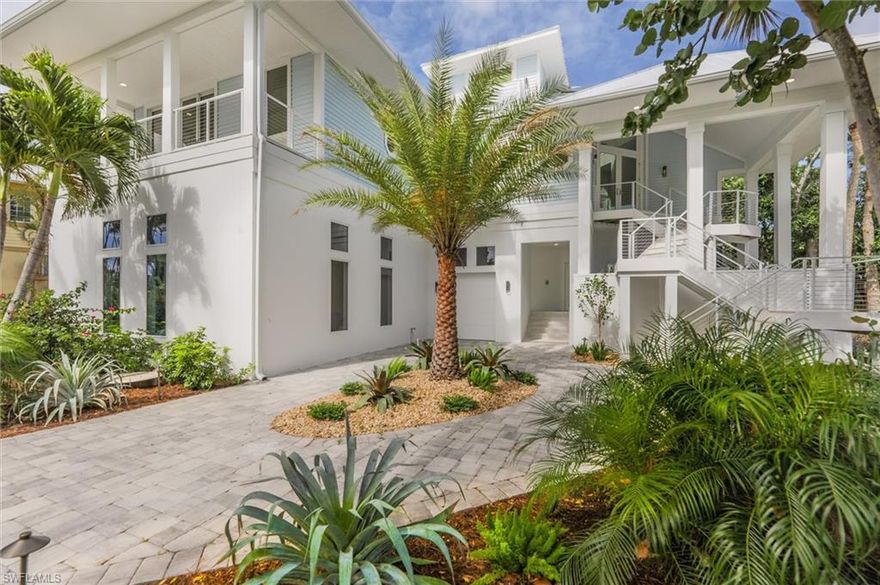 Rare opportunity to purchase a luxurious Gulf Front Estate on Captiva Island within the gated resort community of South Seas.  This stunning, coastal 5 bdrm property offers 102' of beach frontage w/ breathtaking sunsets and views of the gulf.  Totally renovated and remodeled with new quality craftsmanship and attention to every detail.  All new interior furnishings and amenities include, striking quartzite countertops and custom solid wood cabinetry in the kitchen, coffee bar & primary bathroom, beautiful wide plank wood floor throughout, custom ceiling details, private elevator, laundry w/ lots of storage, powder bath, electric blinds and designer furnishings.  The spacious kitchen features a gas Wolf range, beverage cooler, refrigerator, freezer, microwave and dishwasher.  Gorgeious views of the beach from the kitchen, dining & great room.  The penthouse style primary bedroom features a sitting area, laundry, beautiful bathroom and private deck over look the beach which is perfect for enjoying a morning cup of coffee or evening star gazing with a tropical beverage.  Multiple sets of sliders lead to a huge outdoor deck featuring an elevated swimming pool.  The structure has concrete pilings, a new standing seam metal roof, impact glass throughout, expansive circular driveway with pavers, tropical landscaping with pops of color and strategically designed low voltage lighting.  There is an oversized 2 car garage with room for bikes, beach & fishing gear, a separate golf cart garage, and an epoxy finish on the floor.  The bonus area (non-conforming) is fun for guests and a nice addition to the home.  After sun and fun, enjoy the refreshing outdoor shower for a quick rinse before splashing in the pool.  This home has it all ~ location and lifestyle.