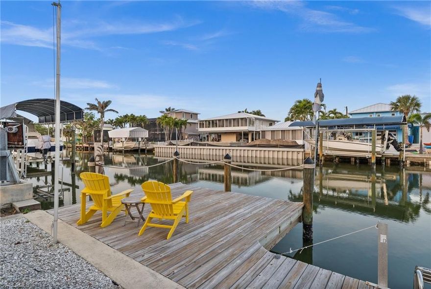 Discover one of the best values on the waterfront in St. James City—where direct, deep-water Gulf access meets effortless island living. This beautifully remodeled 3-bedroom, 2-bath coastal bungalow offers the lifestyle buyers are chasing, without the maintenance and overhead of larger properties. Just minutes to open water, you’ll spend less time navigating canals and more time enjoying world-class fishing, boating, and sunset cruises right from your backyard. Inside, the light-filled open floor plan creates a relaxed, airy feel, perfectly suited for casual coastal living and entertaining. The split-bedroom layout provides privacy for guests, while the updated kitchen and living areas blend modern finishes with laid-back island charm. The primary suite offers a peaceful retreat with a walk-in shower and a spacious closet with convenient access to the laundry area. Step outside and experience what makes this property truly special. The backyard is designed for enjoyment, not upkeep—featuring a low-maintenance dipping pool/spa that delivers year-round versatility without the expense or care of a full-size pool. A tiki hut and generous outdoor space create the perfect setting for entertaining, relaxing, or simply soaking in the waterfront lifestyle. The extended dock places you right at the water’s edge, ideal for morning coffee, evening cocktails, and unforgettable sunset views. For those who value lifestyle over excess, this property shines, Where boats, golf carts, and outdoor living take priority. With major updates already completed—including plumbing, A/C, water heater, appliances, and more—this home offers peace of mind and immediate enjoyment. If you’ve been waiting for an affordable, move-in-ready, direct Gulf access property in St. James City, this is the opportunity.