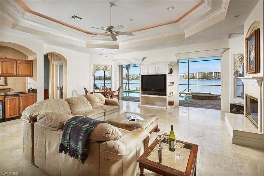 Commanding, panoramic vistas of Venetian Bay are unmatched from this grand Park Shore residence. Filled with natural light, the ideal southwestern orientation offers unsurpassed sunset views all year long. With a sprawling first level, private second story, all-encompassing 5 bedrooms and a den and 4 and a half baths, the floor plan is easily adaptable to accommodate any lifestyle. Consistently and well maintained, residents will appreciate the new roof in 2018. Convenient access to the Gulf for boaters and within walking distance to Venetian Village for indulgent shopping and dining, the location is sure to excite. Voluntary membership to the Park Shore beach association a short distance away round out the idyllic Naples lifestyle.