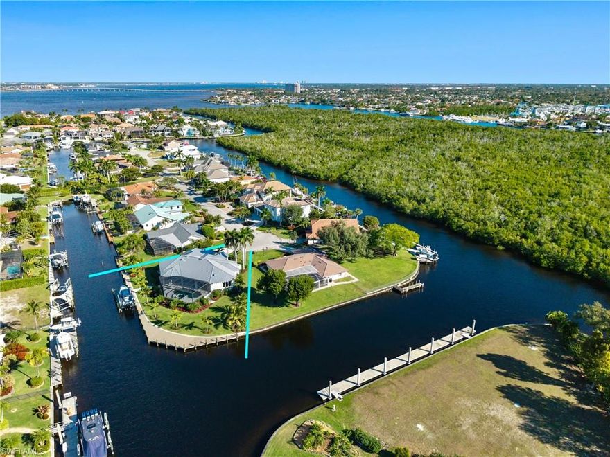Positioned on a SW Exposure point lot in Palmetto Point, this exceptional waterfront estate delivers one of Fort Myers’ most sought-after boating lifestyles, with 220 feet of direct water frontage, brand-new dock and lift, and quick direct access to open waters. Tucked away on a quiet cul-de-sac within a premier boating community, the setting is as private as it is picturesque. The residence spans over 3,400 square feet and has been completely transformed through a $2+ million renovation by a renowned luxury builder, paired with a full designer furnishing package by an industry-leading interior decorator. Offered fully furnished, every space has been thoughtfully curated with custom, made-to-measure furniture and high-end finishes throughout. Inside, an expansive open-concept layout is enhanced by soaring ceilings, rich hardwood flooring, and an abundance of natural light. The home flows effortlessly for both everyday living and entertaining, blending refined design with relaxed coastal elegance. All four bedrooms are generously sized and feature private en-suite baths, creating a true retreat for owners and guests alike. Outdoors, panoramic water views surround the property, setting the stage for the ultimate Florida lifestyle. The outdoor living area includes a fully equipped outdoor kitchen, custom grill, and multiple seating and entertaining spaces, ideal for hosting while watching boats pass through the intersecting canals. This is a rare opportunity to own a fully reimagined, designer-finished waterfront residence that seamlessly blends luxury, privacy, and world-class boating. A true turn-key offering in one of Fort Myers’ most desirable waterfront enclaves.