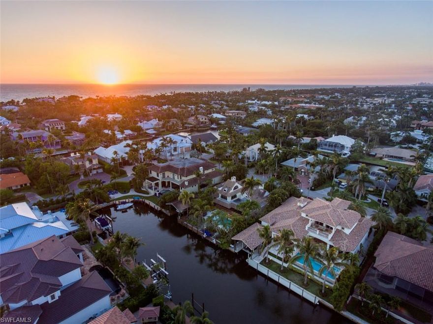 Ideally situated on a quiet tropical stretch in the heart of Aqualane Shores yet mere steps to the beach and 3rd St S, 450 17th Ave S is an awesome retreat befitting the Neapolitan lifestyle. Boasting coveted southern exposure for all day sun, this modern Tuscan style home masterfully combines an open floor plan and soaring ceilings to perfectly frame the inviting outdoor amenities just beyond. The two story dramatic entry with serpentine staircase and ornamental railing are an introduction to the home’s quality and styling. First floor master wing with 4 en suite bedrooms are impeccably designed and built for privacy and tranquility. Incomparable outdoor living area with Wolf range, infinity edge pool and spa coupled with a 60 ft. linear deepwater dock and 36 x 20 ft. covered boat slip makes this a resort- style property. The oversized 3 car garage with car lift, custom Ruffino Cabinetry, state of the art A/V and security system, impact doors and windows and masterful finishes make 450 17th Ave S one of Aqualane’s premier luxury vacation destinations.