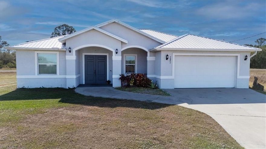 Discover exceptional value in this beautifully designed 3 bedroom, 2 bath home in the desirable Port LaBelle community. Built in 2018 on an oversized 0.32-acre lot, this concrete block residence offers quality construction with hurricane impact doors and windows, along with a durable metal roof for peace of mind and long-term savings.

The inviting front porch with 8’ double door entry opens to vaulted ceilings, an open floor plan, and stylish herringbone-pattern tile plank flooring. The kitchen features an island with bar seating, quartz countertops, and stainless steel appliances, creating a functional space for everyday living and entertaining.

The primary suite includes a walk-in closet and barn-style doors leading to a private bath complete with a freestanding soaking tub and a floor-to-ceiling tiled walk-in shower. A screened lanai extends your living space and overlooks the backyard—an ideal spot to relax and unwind.

Located near local schools, this home offers convenience and comfort for daily life. LaBelle sits just 22 miles east of I-75 toward Fort Myers and approximately 1.5 hours from the Miami area, making commuting and travel easy.

Offered at an affordable price point, this property delivers outstanding value—perfect for buyers seeking a quality home in a growing community.