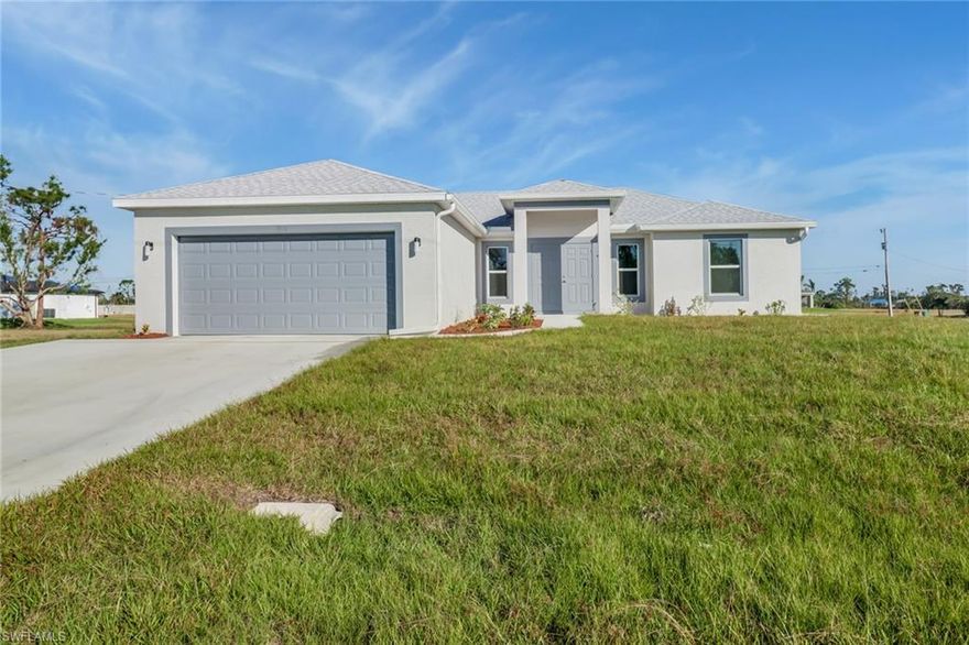 Discover this beautifully finished 4-bedroom, 2-bath home situated on an oversized triple lot in desirable NE Cape Coral. This thoughtfully designed residence features an open and inviting layout with stylish wood plank tile flooring throughout the main living areas, creating a modern yet warm feel. The kitchen is sure to impress with white shaker cabinetry, sleek quartz countertops, and plenty of space for both everyday living and entertaining. The spacious primary suite offers a walk-in closet and a well-appointed en-suite bathroom complete with dual vanities and a walk-in shower. With generous bedroom sizes, contemporary finishes, and a spacious lot offering added outdoor potential, this home is a fantastic opportunity to enjoy comfortable Florida living in a growing Cape Coral location. (This property includes two parcel ids: 19-43-24-C4-05557.0360 & 19-43-24-C4-05557.0380)