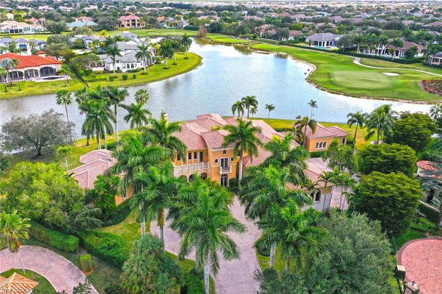 The only 1.25 ACRE ESTATE with 412’ of Lakefront encompassing the Southern & Eastern sides of the property plus panoramic views of golf course. TIMELESS architecture! Dramatic 22’ high ceiling / marble fireplace, walls of glass over looking fountains, & LAVISH  MULTI  LEVEL POOL! A SOOTHING SYMPHONY OF FOUNTAINS AND SPILL OVERS to enjoy from outside loggia. LIBRARY with cherry wood parquet floors, office, fireplace bedroom/ separate baths & 2 closets(hers/ washer & dryer) & french doors to outdoor private gazebo spa, & private patio.Chef’s kitchen /gas cook top, 2 warming ovens, 2 ovens, 2 dish washers, 2 refrigerator drawers, custom WOOD oversized island. Drinks at Sunken Bar equipped with ice maker, refrigerator. Posh theater (seats 14). Separate guest house /living & bedroom opens to labyrinth & fountains. Dramatic marble stair case to second level or take elevator. 3 huge suites all with a view! Total of 5 bedrooms! Impressive curb appeal /circular drive way with center fountain, motor courts,2-2 car garages 20’ height perfect for car lifts. Furnished & full class A Golf membership.