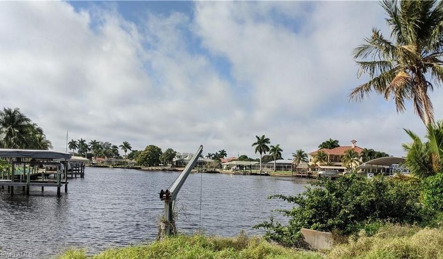 Long Water View! Direct Access, No Bridges, Quick to the River and Away You Go! Best Location to Build your Water Front Dream Home! Property has sea wall with cement dock and davit boat Lift. Impact Fee paid, previous home has been demolished.