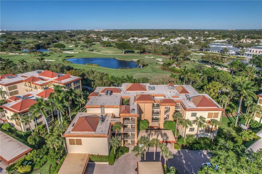 A long, scenic panoramic view of the Pelican Bay Club golf course awaits from this exceptional residence in Interlachen. Welcome to #222, a spacious and light-filled condominium offering tranquil treetop views in a low-density, quiet neighborhood known for its distinctive Frank Lloyd Wright–inspired architecture, newer roofs, lush tropical landscaping, serene lakes, and a private sparkling circular pool with a surrounding moat. Ideally located near the community tram station, this home offers the perfect blend of privacy and convenience. Living like a single-family home, it has 2,311 sq. ft. with an open, airy layout flooded with natural light. Two full walls of sliding glass doors create a seamless indoor-outdoor connection, enhancing the sense of tranquility while overlooking the golf course and surrounding nature. Two extra-large bedrooms, plus a versatile den with a built-in desk area, easily accommodating a pull-out sofa for guests. The all-new, completely remodeled kitchen is a showstopper, featuring white custom cabinetry, quartz countertops, stainless steel appliances, a striking glass backsplash, a built-in pantry, and a charming morning nook. Both bathrooms have been thoughtfully updated with comfort-height vanities, walk-in showers with modern shower tile, glass doors, and stylish finishes. Additional highlights include a dedicated laundry room with full-size washer and dryer, abundant storage, plantation shutters, window treatments, a covered carport, and more. Move in ready — simply unpack and start enjoying the resort lifestyle today. Pelican Bay sets the standard for luxury coastal living in Naples. Residents enjoy an unparalleled beachfront experience with miles of pristine white-sand beaches accessed by tram through protected mangroves, beach attendants provide chair and umbrella service, and waterfront dining and bars at two private beach clubs—an amenity unmatched anywhere else in Naples. Community amenities include 18 har-tru tennis courts, pickleball, sailing, fitness and wellness centers, scenic walking, and biking paths woven throughout beautifully maintained grounds.  Just minutes from Waterside Shops, the renowned ARTIS Center of Performing Arts & the Baker Museum, The Mercato, world-class dining, Whole Foods, and Trader Joe’s. Pelican Bay offers the perfect balance of beachside serenity and everyday convenience. This is truly one of Naples’ finest places to call home.
