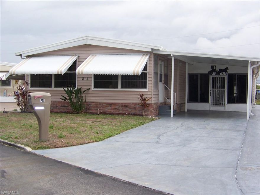 Welcome to Carriage Village, a sociable community where YOU OWN YOUR LAND, the residents are very friendly, you can bring your "fur" babies & have FUN with all the amenities they have to offer! Come take a look at this spacious, well-maintained home that comes furnished/turnkey. The tiled front Florida room is very large & has tons of windows that lets the natural light in, an exterior door to carport & 2 sets of interior sliders. Living room is also quite large with LVP flooring & more windows! The centrally located kitchen is equipped with well-kept  appliances, neutral-colored counters w/matching backsplash, all white cabs/drawers' w/deco hardware, pantry with pull-outs, an exterior door to large lanai & more. Both bedrooms are great size with numerous closets & guest bedroom has built in drawers & even a small BONUS room for whatever you want!!! Both baths have showers ONLY with glass enclosures, NO TUBS IN THIS HOME TO CLEAN!!! Master bath has comfort height single vanity sink & more but you will have to see for yourself how wonderful this home really is!!! The exterior has a multitude of extra items: Tiled all weather lanai with extra hurricane braces & all new tasteful furniture, HUGE laundry(washer 2025) & workshop area with shelving, a double door shed connected to the home w/window, a patio, auto sprinklers on well (sold as-is, Seller never used), downspouts & gutters, critter screening on solid brick skirting, nice long walk-way on side of home. Roof was inspected & in great condition. In 2023 shed, laundry, lanai & carport roofs were replaced thanks to Hurricane Ian. Vapor barrier good as of 2023. Newer windows throughout. A/C maintained regularly & working COLD! NO POPCORN CEILINGS!! Easy drop-down hurricane shutters when needed. And an absolute MUST HAVE .... Did I say there is a TON of CLOSETS in this home!!!!!!Check it out, it won't last long, you'll be so glad you did!