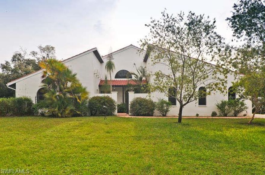 Old Florida still exists! Fabulous Spanish style custom built home ON Telegraph Creek in prestigious Telegraph Creek Estates. Quiet and secluded, this home sits on almost 2 acres on its own cul de sac. Wrought iron gate opens to cozy courtyard main entry to home. Brazilian Cherry hardward floors, carpet and tile.Vaulted ceilings makes this home live much larger than it's 2423 SF. Spectacular custom stonefront wood burning fireplace in family room creates a wonderful ambiance. Enormous dining room opens to the rear with french doors. Master br opens to pool and has gas fireplace.  Kitchen is spacious w/custom built-ins and solid surface countertops with a gas stove. Back yard has fenced area for dogs. Beyond is all natural setting leading to the creek. Canoe or kayak to the Caloosahatchee River through unspoiled nature via beautiful Telegraph Creek. Home is original to date of build.