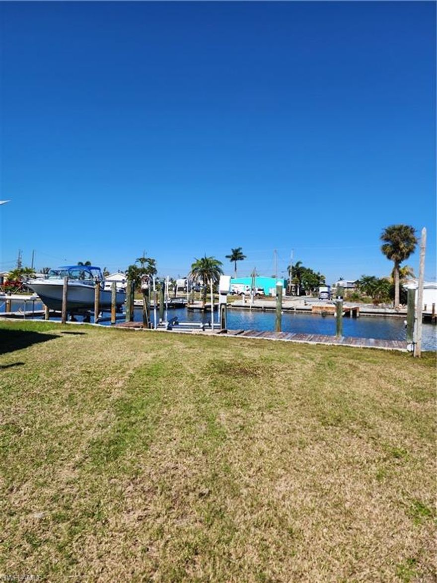ESCAPE TO PARADISE in St. James City, Pine Island, Florida! This exceptional residential vacant lot offers a slice of island living with dimensions of 40' wide by 90' deep. Situated along a wide (81'-120') tranquil canal, the property boasts a private boat dock with lift, spanning its 40' width, granting direct access to the Gulf of Mexico for endless aquatic adventures.
Imagine waking up to the gentle rustle of palm trees and the soothing sounds of the water lapping against the shore. This quiet neighborhood invites you to embrace the serene ambiance of island life, where everyday stresses melt away, and each moment is filled with possibility.
For the avid angler and boating enthusiast, St. James City is a haven of opportunity. Renowned for its excellent fishing and boating, the area promises thrilling adventures and unforgettable experiences. Cast your cares away as you explore the waters and encounter the vibrant marine life that calls these shores home.
Convenience meets comfort with electricity available at the dock, ensuring your waterfront retreat is as practical as it is picturesque. Zoned for manufactured/mobile homes, the property offers flexibility to design your ideal island getaway, tailored to your lifestyle and preferences.
Complete with a sturdy concrete seawall, this property offers peace of mind and protection against the elements, safeguarding your investment for years to come.
Don't miss your chance to own a piece of waterfront paradise in St. James City, where every day feels like a vacation. Embrace the essence of island living and make your dreams a reality today!