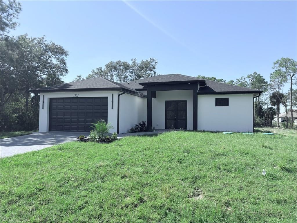 Photo of 1503 Calvin AVE, LEHIGH ACRES, FL 33972 (MLS # 225077909)
