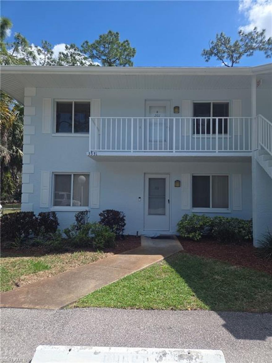 RARELY AVAILABLE, HIGHLY DESIRABLE 2 bed/2 bath 2nd floor garden style condo in the quaint, pet-friendly community of Woodmere Racquet Club! Enjoy the community's pool, 2 tennis courts, and wooded paths. Fully tiled throughout, this home features a large eat-in kitchen with new countertops, double sink, and loads of cabinets. Large living/dining area opens to sliders leading out to your screened lanai with a peaceful wooded view - ideal for enjoying the weather with coffee in the mornings, and cocktails and dinner in the evenings. Huge owner's suite is flooded with light, features oversized fully tiled shower, and walk-in closet. Second large bedroom with closet, second full bath with tub/shower combo. Separate laundry room is ideal for additional storage. Centrally located - just a short 10 minute drive to the beaches, downtown area and shopping/dining options.