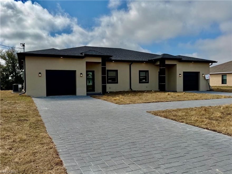 Stunning new construction waterfront duplex in desirable SE Cape Coral. Each side offers 3 bedrooms, 2 baths, an open-concept layout, warm designer tile flooring, and elegant finishing touches throughout. Duplex is on THREE LOTS!!- 10Ft ceilings, soft close wood cabinets, pictures will not convey. Lots of luxury. The primary suite features a stylish, space-saving barn door leading to a double-sink primary restroom. Privacy-glazed glass front door allows abundant natural light. The south-facing backyard overlooks a relaxing canal and has room for a pool. This oversized lot allows for future expansions, rare to find three lot size. Ideal for investment or owner-occupant.