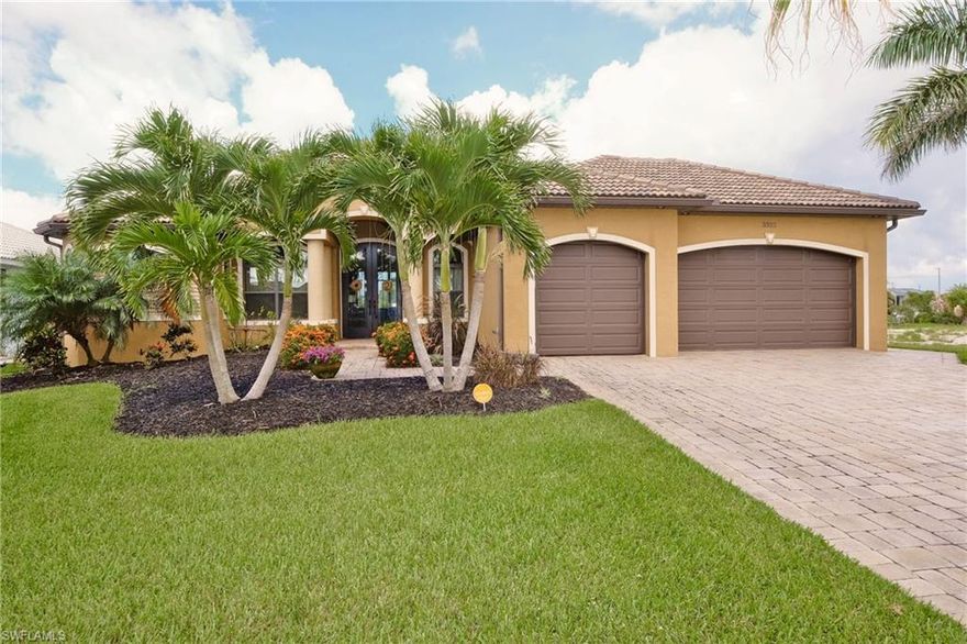 NEW PRICE! BEFORE you BUILD, you MUST SEE this ALMOST NEW, GORGEOUS, GULF ACCESS 4 bed+den, 3 bath, 3-car garage, CUSTOM Home!  Located in coveted SW Cape near Surfside with ALL ASSESSMENTS PAID! This is NOT a SPEC HOME! This is a REAL HOME that was DESIGNED for SW FL LIVING and you will definitely agree that NO DETAIL HAS BEEN MISSED! Everything you would think to include in your new home build, AND MORE, is in this home! Here are some highlights: Composite BOAT DOCK! 10,000 lb. LIFT w/canopy! SALTWATER, HEATED POOL w/SUN SHELF and WATERFALL! OUTDOOR KITCHEN!  WHOLE House GENERATOR Plug! 10 ft. DOUBLE MAHOGANY Front Doors w/iron grills! 14-15 ft. CEILINGS w/5 CUSTOM COFFERED and lit, Trays! 10 ft. high and 16 ft. wide POCKET SLIDERS to lanai! IMPACT GLASS & Roll down SHUTTERS! 8" CROWN & BASE MOLDINGS! CUSTOM GOURMET KITCHEN! LUXURY MASTER BATH! 24" PORCELAIN tile! 8 ft. interior doors! CUSTOM Fans & Fixtures, including kitchen & bathroom FANS!