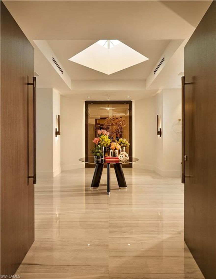 This is a level of luxury to behold. Enter into one of the most exclusive penthouses that Naples has ever seen. Beyond the interior design, this space is centered on 360-degree views. The entire penthouse is outfitted with a range of state-of-the-art LED recessed lighting, beautiful custom furnishings, modern decorative fixtures and versatile LED Kreon art lights to highlight both architectural details and fine art. The flooring is large-format Italian porcelain of 31-by-72-inch slabs that run throughout the interior and exterior of the unit. Crestron and Lutron hybrid automation system for audio, lighting and temperature controls, custom millwork in exotic real wood veneers and high-end Italian melamine are all of note. Custom kitchen has Gaggenau and Sub-Zero appliances, white quartz countertops and a private elevator clad with high-polish mirrored nickel finish. Oversized dual closets, including a cedar closet, sauna, as well as a fitness room with a view. High-end innovative plumbing fixtures, such as the powder room faucet from ceiling and sculptural bathtub in master bath. This penthouse comes completely furnished. Get ready to be in awe!