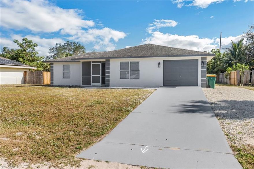 Move-in ready 3-bedroom, 2-bathroom home in the heart of Golden Gate City! This beautifully renovated property features a spacious open floor plan, a modern kitchen with updated finishes, fixtures and sleek bathrooms. Stainless steel appliances and quartz countertops are gorgeous! Enjoy the large backyard—perfect for outdoor entertaining—with ample room to add a pool. Relax in the expansive lanai and make the most of Florida living. A 1-car garage provides additional storage and convenience. Nestled in a prime location close to schools, shopping, dining, and just a short drive to Naples' stunning beaches.