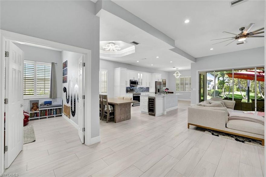 Welcome home to your COMPLETELY RENOVATED North Naples oasis, ideally positioned on a quiet street with tranquil lake views. Every inch of this stunning residence has been thoughtfully redesigned with high-end finishes—no detail overlooked.

At the center of the home is a beautifully reimagined chef’s kitchen, featuring an open-concept layout, an oversized quartz island, and brand-new premium appliances, including a wine cooler—perfect for both entertaining and everyday living. Elegant custom tile flooring runs seamlessly throughout, creating a clean, modern aesthetic.
A flexible bonus space offers endless possibilities for a home office, den, or additional living area. The luxurious primary suite is a true retreat, complete with a spa-like bathroom showcasing a freestanding soaking tub, dual quartz vanities, and a spacious walk-in shower with custom tile work.

Enjoy peace of mind with major updates already completed, including a newer A/C, hot water heater, washer and dryer, along with upgraded designer lighting and fixtures throughout.

Located west of I-75, this home is just minutes from Naples’ world-renowned beaches, upscale shopping, fine dining, and Southwest Florida International Airport. Situated within an A-rated school district and zoned for the new Aubrey Rogers High School.

Set within the highly desirable guard-gated community of Delasol, residents enjoy low HOA fees that include resort-style amenities, plus Xfinity cable and internet. Best of all, Delasol is a NO FLOOD ZONE!