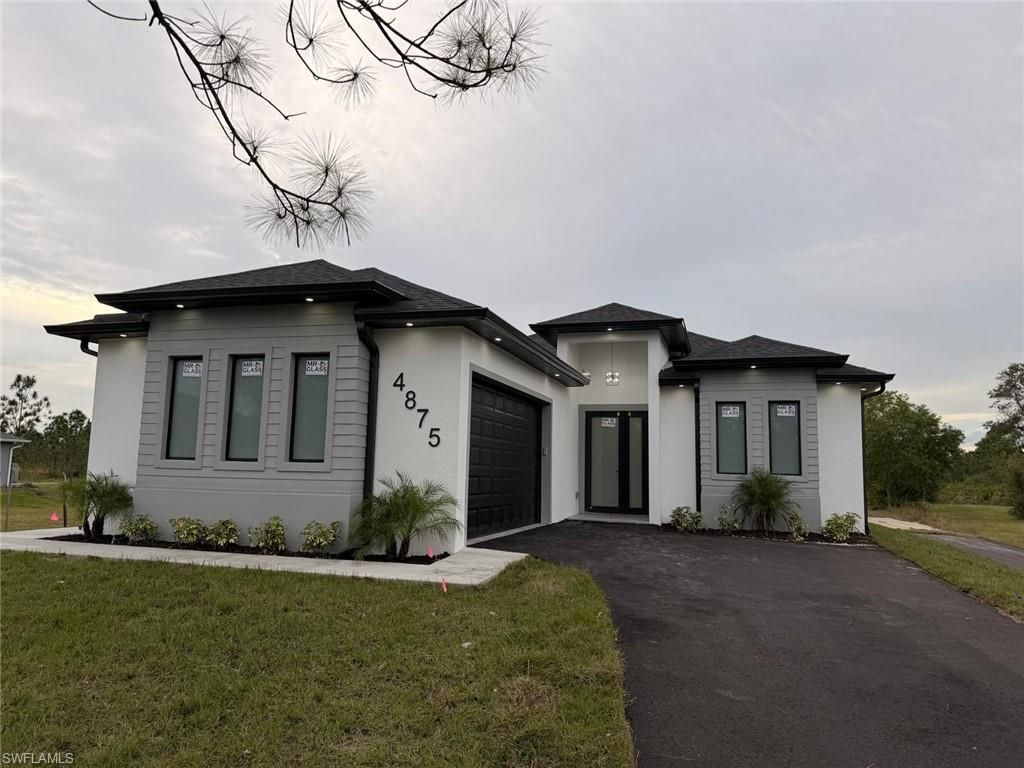Photo of 4875 EVERGLADES BLVD N, NAPLES, FL 34120 (MLS # 225083640)