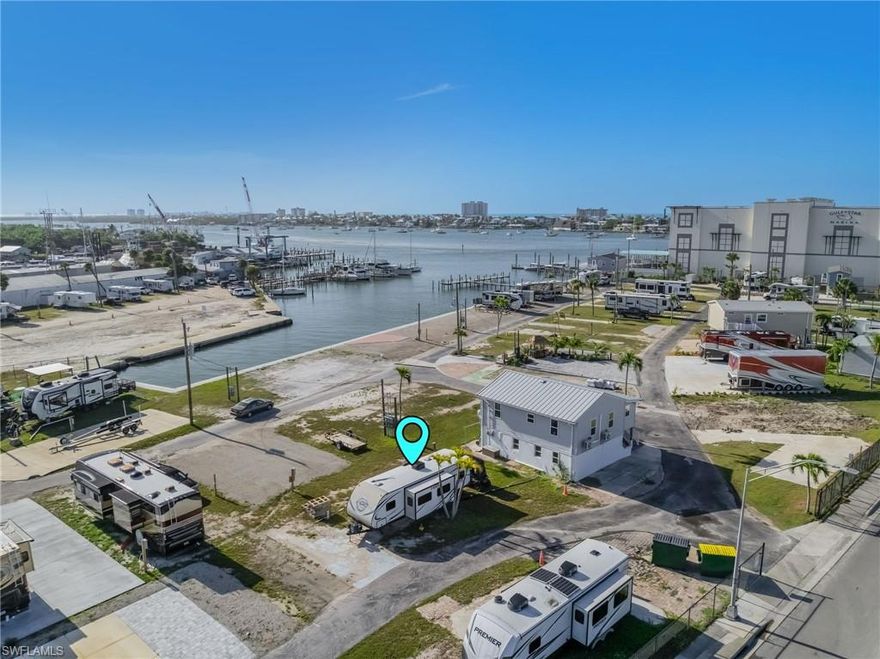 You can't get closer to the Beach without being on the Beach! Just walk over the bridge and you are on the Ft Myers Beach! Gulf Cove is a Co-op property which means you own 1/60th of the park. This is a waterfront community with docks to be completed this year. The Board of directors are working on a process for the boat assignments and annual costs. Low condo fees ~ Only $800.@ quarter. Sewer, water and electric are available at each site. No pets are allowed unless you have medical Great Park, Great location! Come check it out!  This property comes with a RV already in place.
