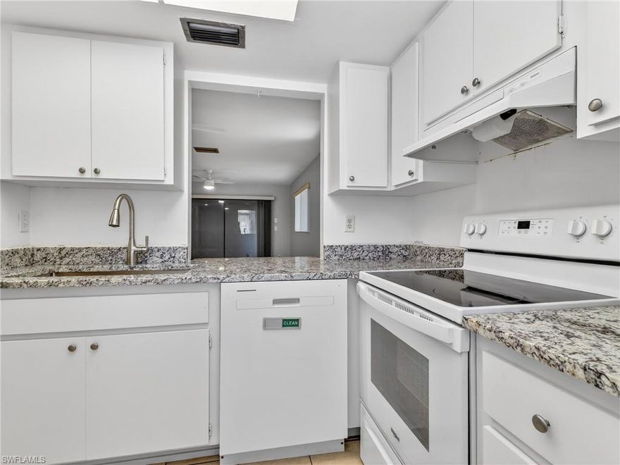 You've heard it before....LOCATION, LOCATION, LOCATION!  This one is truly convenient with a central location only two minutes to the Midpoint Bridge and walking distance to shops, restaurants, and entertainment!  Just off Del Prado Blvd you can walk to the movies, mall and so much more.  Move-in ready, and ground level, this 2BR/2BA, end unit has all tile floors for easy maintenance and fresh interior paint.  New bathroom vanities with Shaker style cabinets, granite tops and new faucets. Both showers are tile. The white kitchen has a large stainless sink and granite counters.  The appliances are approximately 4-5 years, A/C 3-4 years and water heater 8 years.  There is a washer & dryer in the unit.  Light and open with good sized bedrooms and a large walk-in closet in the master.  Most rooms have new ceiling fans. The screened lanai is very private. Low fees of $370/mo and assigned parking right outside your door!  Downtown Cape, Cape Harbour & Cape Coral Hospital are all about 10 mins.  30-35 mins to SW International airport or Punta Gorda airport & 30 mins to the beach!