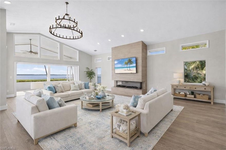 Breezy. Bright. Riverfront. Set along a prized stretch of the Caloosahatchee River, this fully renovated waterfront residence offers the rare combination of modern luxury, generous land, and true boating capability. 

The four-bedroom, three-bathroom home has been completely reimagined with sleek contemporary finishes and major system upgrades for peace of mind, including a new roof, new HVAC systems, and all-new appliances. The kitchen is a showpiece, designed for both entertaining and everyday living, featuring clean lines, premium materials, and an effortless flow into the main living spaces. Updated flooring unifies the interior with a refined, modern feel, while the bathrooms echo the same elevated aesthetic. The primary suite is a private sanctuary, highlighted by a luxurious steam shower that brings a spa experience home.

Walls of glass draw the eye outdoors, where the river becomes your daily backdrop. Each evening delivers a front-row seat to glowing sunsets that paint the water in gold and crimson — a private spectacle that never repeats and never disappoints. Electric hurricane shutters enclose the lanai, providing both security and convenience without sacrificing the view.

The expansive lot enhances the sense of privacy and possibility. A sparkling pool anchors the outdoor space, surrounded by ample room to design the ultimate waterfront retreat. The layout is ideal for a future outdoor kitchen, lounge areas, and fire-lit gatherings under the stars, making the property as suited for quiet relaxation as it is for unforgettable entertaining.

This is a home where renovation meets location — modern living paired with one of Southwest Florida’s most coveted riverfront settings. A rare opportunity to own direct river frontage, breathtaking views, and a lifestyle defined by sunsets, boating, and effortless luxury.