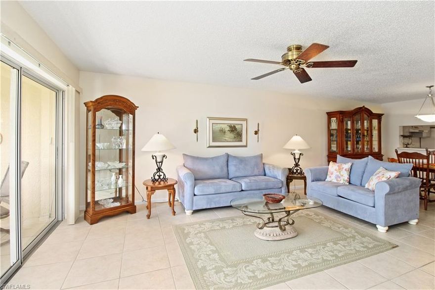 Royal Wood Golf Club-Amberly Village. Roomy First floor end unit with 2 BR, DEN with window, 2 BA. Lake and golf course views and southern exposure from lanai that also has electric storm shutters. Mostly tile floors, except in bedrooms. 1400sq.ft. of east living  Turnkey furnished and ready for season.  Newer air .Large laundry room.  Covered car port. Steps to heated pool, spa, bocce, tennis and pickle ball. Royal Wood has just completed a $5,000,000. renovation updating the clubhouse, restaurant, proshop, library and fitness center.  Be sure to check out the pictures! Lots of activities including golfing events, parties, trivia, and cards. Short drive to the beach and downtown Naples.