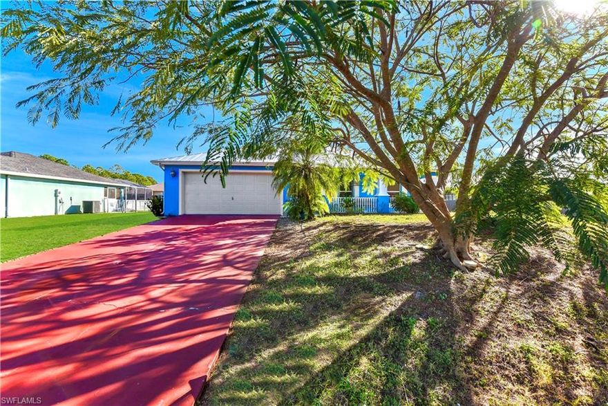 Welcome to this 3/2 + DEN nestled on a quiet street just minutes from State Road 82, Fort Myers, and major amenities. This open floor plan has been freshly painted & spotlights a 2023 METAL roof, 2021 HVAC system, an inviting tiled front porch, and premium luxury vinyl flooring and porcelain tile throughout. It also highlights an attractive glass French door leads into the den, while the open great room is enhanced by cathedral ceilings, recessed and pendant lighting, and a welcoming breakfast bar. The kitchen offers NEWER appliances, a tiled backsplash, and upgraded fixtures. Enjoy seamless indoor-outdoor living with refreshing triple sliding doors opening to the screened back patio. Additional features include laundry under air, walk-in and dual closets, and a newer water softener system. Outside, the property is complemented by mature landscaping, fruit trees, decorative shutters, and an irrigation system. NOT located in a flood zone. Schedule your showing today!