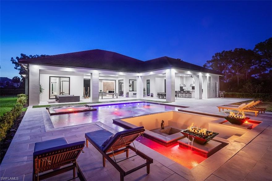 Live a stylish, relaxed life in this icon of sophistication located in one of America’s top rated neighborhoods, Pine Ridge Estates! Enjoy the airy, sun-drenched space that flows seamlessly from the inside to the outdoors. 

No detail was overlooked in this contemporary, open floor-plan home with tasteful design statements. Treat your friends to gourmet meals in the fabulous kitchen appointed with Wolf appliances. Host a movie night in the state-of-the-art theatre; easily work-from-home in your private office. Designed for privacy, the split floor plan divides the luxurious master from the guest rooms.

With paradise in your backyard, endless entertainment awaits for kids, pets, or adults. More than an acre of beautifully landscaped grounds boasts an outdoor kitchen, fire pit, spa, and pool. Spend your days lounging on the sun shelf, or play a game of croquet, bocce, and badminton games...all at once! There is also a massive, air conditioned separate garage for the car connoisseur, hobbyist, or artist.