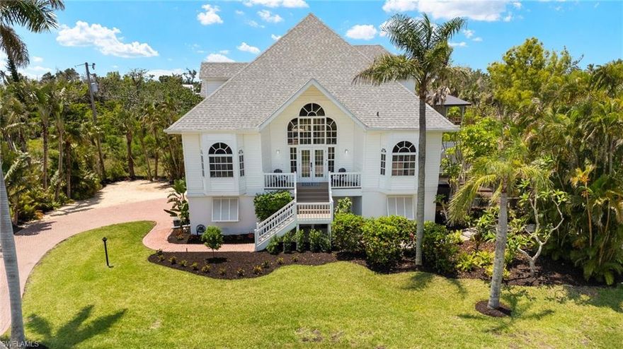 From the moment you step inside this casually elegant pool home, you will feel you have arrived! From the grand front staircase to soaring ceilings and spacious and inviting living areas, island life is ideal on Wilton Lane. This architectural gem with charming curb appeal is an ideal vacation home or full-time residence. The oversized kitchen is perfect for entertaining with spacious dining room living room, and den all opening out to your screen enclosed lanai. Lovely primary bedroom includes large walk in closet, and roomy primary bathroom. Two upstairs bedrooms are split floor plan providing privacy and includes an oversized 3rd bedroom for additional guests. The screen enclosed pool and spa have been resurfaced including new tile with luxury pebble finish, new lights, all new motor, and pump with remote automation for both pool and hot tub spa. New landscaping including new sod, beds, trees, plantings, and new fenced yard enhances the enjoyment of this property. Other updates include new and upgrading lighting, ceiling fans, addition of new central air conditioning branch in the guest bedrooms, keyless entry, painting and bathroom refreshes, new irrigation in 3 areas of the yard, and replaced all the abandoned areas to accommodate the new plantings and grass. Schedule your showing today to view this lovely island home!