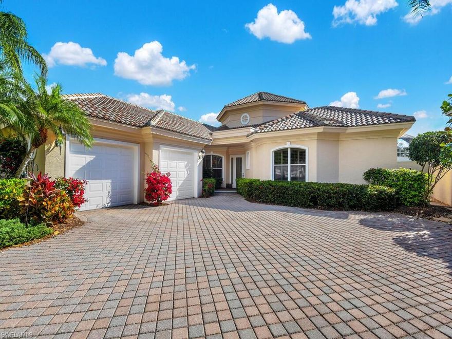 Welcome to the picturesque Fiddlesticks Country Club. This stunning custom home built by Mariner Homes resides in highly sought-after St Andrews and overlooks the 18th par 5 finishing hole. This is a one-owner well cared for & kept home. You are welcomed by large tray ceilings, vast water and golf course views the moment you enter the door. The kitchen offers white cabinets with an oversized island overlooking the living and dining area. True split bedroom floor plan with both bedrooms having their own bathrooms. The guest suite is large enough for two beds and has sliders out to the pool deck. The owner suite has dual ensuites and sliders out to the lanai. Large flex room for either an office or third bedroom comes complete with wood built in desks and storage. The home is highlighted with long paver driveway, custom trim work, plantation shutters, crown molding and water views from almost every room in the house. Enjoy peaceful evenings from your heated pool. FCC offers world class amenities such as 36 holes on two premiere golf courses. Tru hard tennis courts, separate pickleball courts, bocce, golf training facilities, state of the art gym, restaurants, tiki bar and resort pool