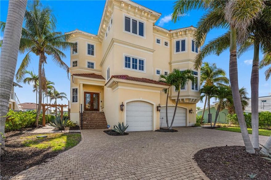 Waterfront Living at Its Best! Welcome to your ultimate fun-filled getaway just minutes from Fort Myers Beach! This 6-bedroom, 7-bathroom canal-front home is designed for making unforgettable memories—whether you're cruising the waterways, hosting poolside parties, or soaking up sun-filled days with the people you love most. The ground level sets the vibe with a custom wrap-around bar—complete with a 12’ shark hanging overhead! Kick back in the theater room or perfect your swing on the indoor golf simulator. The relaxed lounge area flows seamlessly to your Private Saltwater Pool and Spa. A tiki hut adds a tropical touch, while the Massive Sun Deck with dining and lounge areas—features a boat lift and large slip for your water toys, so you’re always just moments from your next adventure. The 80' Wide Canal makes it easy to accommodate most vessels. Take the Private Elevator up to the second floor, where everyday living meets effortless entertaining. The open-concept layout includes a gourmet kitchen with built-in appliances, a center island cooktop, an oversized breakfast bar, and a spacious eat-in dining area. Exposed beams, a stone accent wall, and a cozy fireplace add warmth and style. Slide open the Collapsible Glass Doors and expand your living space onto a Huge Balcony  overlooking the pool and canal. With a full Outdoor Kitchen and Built-in BBQ, it’s the perfect place to grill, gather, and enjoy the coastal breeze. Upstairs, the third floor features three additional bedrooms—including two spacious en-suite rooms and a Luxurious Primary Suite with a Spa-like Bathroom offering a soaking jet tub and an expansive walk-around shower. But the real showstopper? The Private, oversized third-floor balcony, where you’ll enjoy Epic Panoramic Views of the canal, nature preserve, and front-row seats to Southwest Florida’s jaw-dropping sunsets—a picture-perfect backdrop for peaceful mornings or starlit evenings. Conveniently tucked away from the tourist buzz yet just a short ride to Fort Myers Beach, Sanibel Island, and Cayo Costa State Park, this home delivers the perfect blend of adventure, comfort, and coastal lifestyle. From boat days and BBQ nights to movie marathons and poolside laughs—this is where lifelong memories are made! **Be sure to request the Cinematic Video Tour and 3D Walk-through!