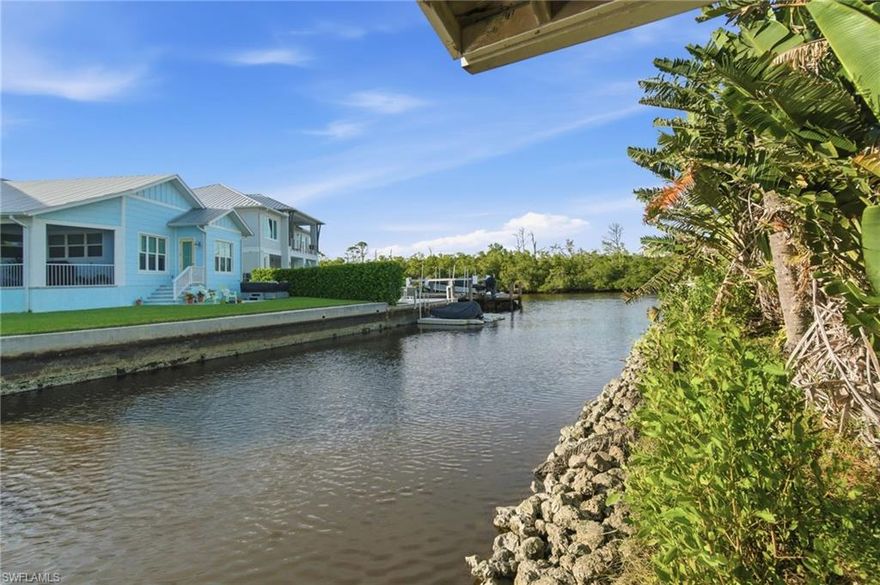 Welcome to 1138 Christopher Court, a rare Gulf-access homesite offering an effortless and scenic boat ride to Naples Bay—where sunsets, waterfront dining, and open-water adventure await. This exceptional opportunity allows you to reimagine and build in one of Naples’ most charming and accessible neighborhoods, tucked on a quiet cul-de-sac just 1.5 miles from world-renowned Fifth Avenue South. Here, upscale dining, boutique shopping, vibrant galleries, and the sugar-sand beaches that define the Naples lifestyle are all just minutes away. 
Set on a generous 0.28-acre (12,259 SF) parcel, the property features 40 feet of waterfront complete with a covered boat dock, offering an ideal canvas for a custom residence designed to embrace indoor-outdoor living. There is ample room for a pool, gardens, and expansive outdoor entertaining while still maintaining privacy and a serene setting. The neighborhood’s voluntary HOA provides desirable flexibility while preserving the well-kept, welcoming atmosphere that residents love. With its unparalleled location, boating access, and outstanding build potential, this property isn’t just a vacant lot—it’s the beginning of the Naples dream home you’ve been imagining.       A land survey and full set of custom home plans are available upon request