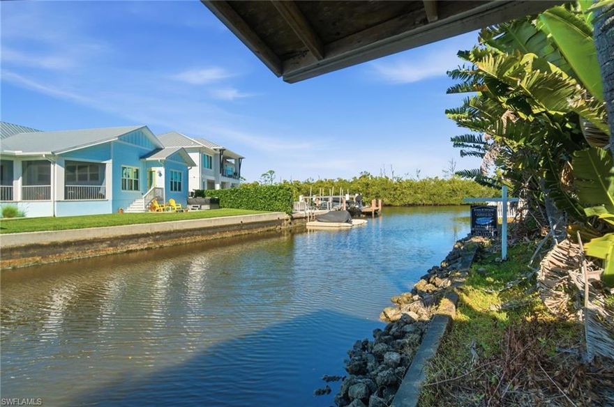 Welcome to 1138 Christopher Court, a rare Gulf-access homesite offering an effortless and scenic boat ride from your covered boat lift to Naples Bay—where golden sunsets, waterfront dining, and open-water adventure become part of everyday life. Tucked away on a quiet cul-de-sac, this exceptional 0.28-acre (12,259 SF) waterfront lot presents a unique opportunity to build your custom dream home in one of Naples’ most charming and rapidly evolving neighborhoods—just 1.5 miles from iconic Fifth Avenue South.
The property features 40 feet of waterfront complete with a covered boat dock, creating the perfect foundation for a residence designed around seamless indoor-outdoor living. There is ample space for a pool, lush gardens, and expansive outdoor entertaining areas, all while maintaining a sense of privacy and tranquility. A land survey and a full set of architectural plans for a custom home are already complete and available, allowing you to fast-track your vision.
Christopher Court is undergoing an exciting transformation, with multiple luxury new-construction homes in progress that are quickly elevating the street into a refined enclave of modern coastal residences. The surrounding neighborhood is equally dynamic, highlighted by the redevelopment of Metropolitan Naples, bringing ground-level boutique shops and restaurants, Class-A office space, and structured parking. Nearby Oakes Farm is anticipated to return as a two-story grocer within a larger five-acre development along Davis Boulevard—effectively extending the energy and walkability of Fifth Avenue. This expansion will introduce additional dining, hotels, a new marina, and lifestyle amenities, all within walking distance to this LOT.
The neighborhood’s voluntary HOA offers desirable flexibility while preserving the well-kept, welcoming character residents appreciate. With its unmatched location, direct boating access, and outstanding build potential, this is more than a vacant lot—it’s the foundation for an exceptional Naples lifestyle. Upscale dining, boutique shopping, vibrant galleries, and the sugar-sand beaches Naples is known for are all just minutes away.