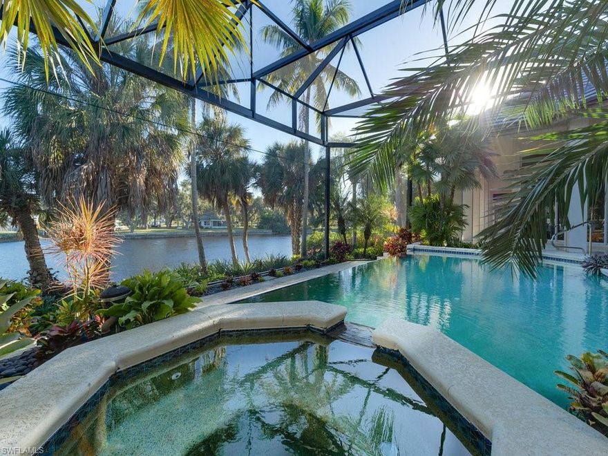 One of 11 homes in exclusive Marina Pointe along the Imperial River with Gulf access.
Magnificent River views of manatees, osprey, dolphins, eagles and more. One of a kind pool area with rare tropical plants offering a true paradise. Nature surrounds this lovely lot with incredible privacy. Resort living at its best to live and entertain.  New roof in 2021.