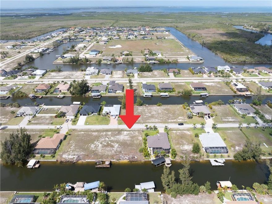 There’s something quietly powerful about a waterfront homesite that invites both immediate enjoyment and long-term vision—and this Gulf access lot along the Penelop Canal in Unit 61 does exactly that. With approximately 80 feet of waterfront and a generous 125-foot depth, you have the space and flexibility to design a home that truly reflects how you want to live, both inside and out.

From the moment you build, the water becomes part of your everyday rhythm. Step out your back door, cross your lanai, and you’re just moments from your boat—ready for an early morning cruise, an afternoon island hop, or a full day exploring the Gulf of Mexico. From here, iconic destinations like Cayo Costa, Cabbage Key, Sanibel, and Boca Grande are all within reach. Whether it’s docking for waterfront dining, casting a line offshore, or finding a quiet stretch of beach to unwind, this location places Southwest Florida’s boating lifestyle right at your fingertips.

The eastern rear exposure brings its own kind of magic—one that often gets overlooked but quickly becomes a favorite. Your backyard will greet the day with soft, glowing sunrises and gentle morning light, creating a peaceful and energizing start to each day. Afternoons offer a more comfortable outdoor experience, with natural shade over your future lanai and pool area—ideal for year-round living without the intensity of direct western sun. It’s a setting that invites slow mornings, shaded afternoons, and a lifestyle that feels both relaxed and refined.

Positioned just about a mile from the highly anticipated Seven Islands development, this property sits in one of Cape Coral’s most talked-about growth corridors. The City’s Vision Plan continues to bring momentum to this area, with new construction homes and investment shaping a vibrant future. As Seven Islands evolves—with planned marina access, dining, recreation, and gathering spaces—you’ll find yourself not only enjoying today’s waterfront lifestyle but also benefiting from the long-term potential of the surrounding development.

Beyond the canal, you’re just a few miles from a championship golf course, with expanding options for shopping and dining nearby. Travel remains convenient, with Southwest Florida International Airport roughly 30 miles away and Punta Gorda Airport about 20 miles from your doorstep.

This isn’t just a piece of land—it’s the beginning of something personal. A place where mornings start with light dancing across the water, where boating becomes second nature, and where the future of the area continues to unfold around you. If you’ve been waiting for the right setting to bring your waterfront vision to life, this may be the one that feels just right.