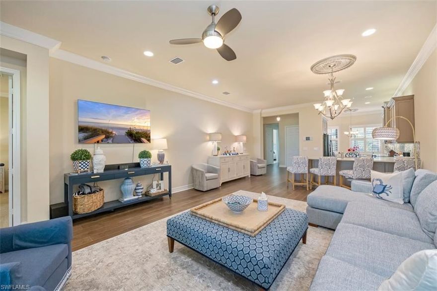 "Live Life Beautifully in Southwest Florida" Discover the beauty of Southwest Florida living in this stunning attached villa located in the highly sought-after Marbella Isles community. This 2-bedroom plus den, 2-bath home is filled with thoughtful upgrades and luxury touches that make it truly one of a kind. From the moment you enter, you’ll notice the attention to detail — engineered hardwood floors, upgraded cabinetry, and solid hardwood doors set a tone of quality and sophistication. The home features over $90,000 in builder and post-build upgrades, including: Built-in radio and intercom system throughout the home, Crown Moldings, Instant hot water dispenser at the kitchen sink Custom front entry screens for comfort and airflow, Upgraded attic and garage door insulation, Built-in pull-down stairs for easy attic access, Epoxy-finished garage floor and widened driveway for additional parking, & a Brinks 2’ x 3’ floor safe, bolted securely in the guest closet Peace of mind comes standard with hurricane-impact windows and sliders, electric lanai shutter, custom interior electric shades, and a recent Wind Mitigation report confirming compliance with today’s hurricane standards. A new HVAC system (installed July 2025) ensures year-round comfort, while plantation shutters and a custom gutter system complete the list of thoughtful details. Just a short stroll from your front door is the Marbella Isles Clubhouse, where resort-style amenities await: Sparkling resort pool and kiddie pool with slides, Fitness center, game room, and card room. Half-court basketball, volleyball, pickleball, bocce, and tennis plus A full-time social director organizing community events year-round. Located in the heart of Naples, Marbella Isles offers 24-hour guard-gated security and low HOA fees, all within minutes of white-sand beaches (10 min), downtown Naples (15 min), and Southwest Florida International Airport (25 min). Live beautifully. Live conveniently. Live the Marbella Isles lifestyle.