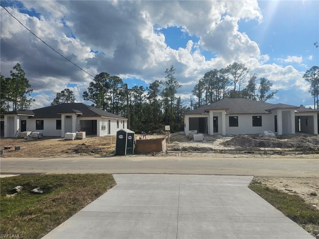 Photo of 321-323 URBANA ST, LEHIGH ACRES, FL 33974 (MLS # 226018347)