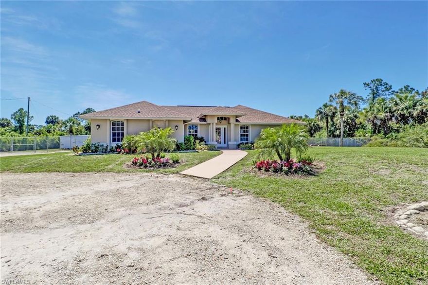 No detailed missed! IMMACULATE  HOME WITH ALL THE BELLS AND WHISTLES!! Come and enjoy the NO HOA Living. This fantastic move-in REady HOME is everything you need. This home has a smart floor plan offering plenty of entertaining space, three bedrooms, two bathrooms,  open kitchen concept- Solid wood cabinet (soft close Drawers,  crown molding in all rooms, Traverine throughout entire home (except master), LED light lighting throughout the house, including a large laundry, New tankless water heater, New irrigation system,  completely remodeled. As if that wasn't enough oversized screen lanai, property sitting on 2.81 acres! Plenty of space for a pool! Both roofs NEWER 2018!!!New Ac 2019 Better than NEW!-Extra building is a 1200 Sq ft Garage/storage 30 x40 And the convenience of the new Publix shopping plaza in this fast-growing area.