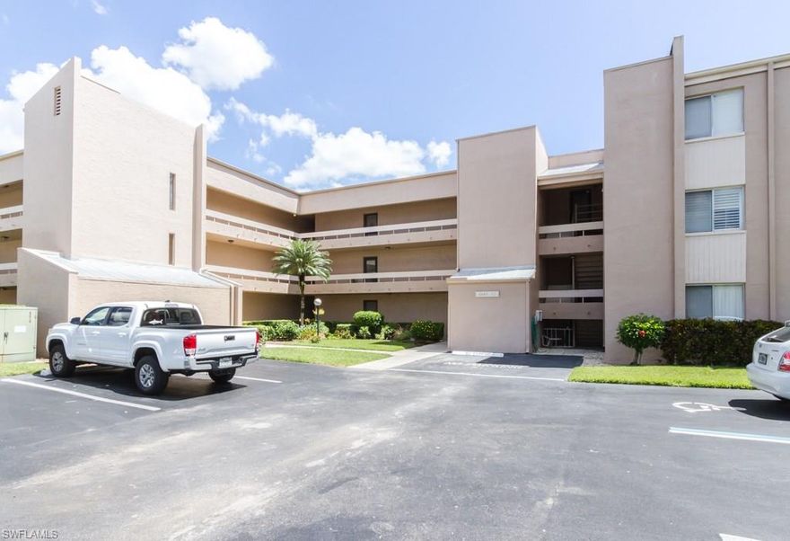 Wonderful location, close to Olde Naples, great shops, beaches and more. Tranquil views of lush landscaping from this 1st floor unit. Spacious living room and separate dining area and great lanai space overlooking the gardens. Newer windows in the bedroom and the washing machine and fridge are newer also(last 4 years). Lakewood Country Club is open to the public for dinner and golf is available if you want to join. Small storage area also included with the home and a covered carport-this home is ready for your touches and is being sold "as is". Parking space is #14.