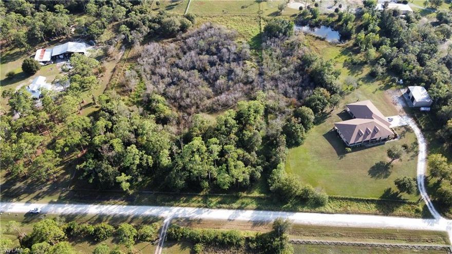 Rare opportunity. Almost 5 acres right off of Nalle and Nalle Grade Rd. Beautifully wooded lot with a small pond, fully fenced with gate access already in place. Build your farmhouse and bring your animals to this country setting. Just five minutes to I-75, 20 minutes to Southwest Florida international airport, 30 minutes to Punta Gorda Airport Multiple Publix grocery stores within 10 minute drive.