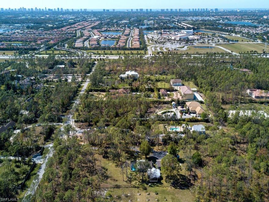 L.2010 - 26°13'44.27"N - 81°44'52.46"W Since the beginning of time, man has always developed the best parcels of land first, hence Location, Location, Location.  Come see why this property was the first lot developed in 1970 by its pioneer first owners in what is now heralded Livingston Woods.  Nested on Hunter’s Rd, arguably the nicest street of similar lots and sprawling estate homes with likeminded owners.  Sited in the northwest corner of Livingston Woods this 2.7 acres of selectively cleared wooded acres with pines and palmettos, is ready for YOUR sprawling estate home.  One of only a dozen lots that remain in Livingston Woods.  Almost ¾ of a mile from I-75 and ¼ mile from Livingston Rd noise makes for quiet enjoyment.  Attention investors, and custom home builders, Pine Ridge vs. Livingston Woods offers twice the land at three times the value.  Save on lot clearing, utility connections, fill and impact fees.  Home is being sold for lot value.