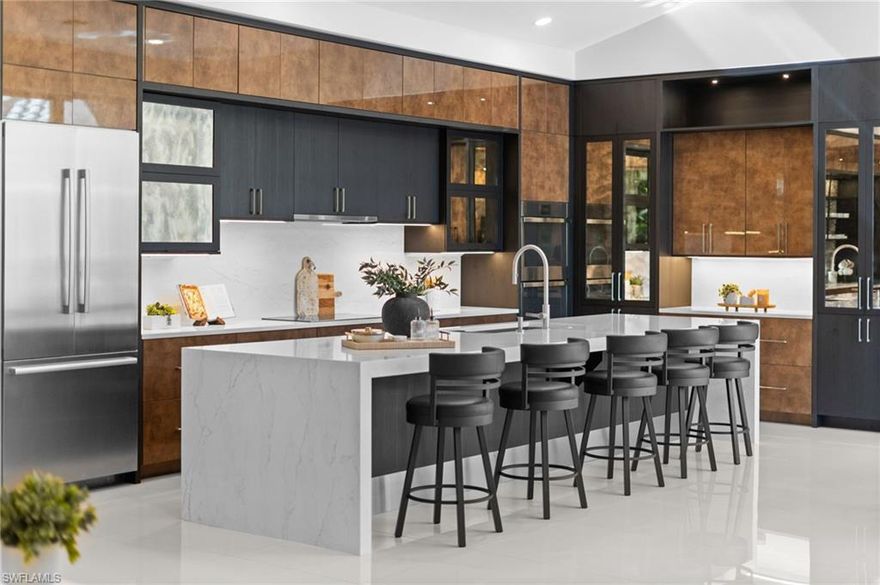 Experience ideal modern living in this meticulously renovated masterpiece, situated on a rare .38-acre lot in one of Bonita Bay's most desirable and serene enclaves. Nearly 3,000 square feet of completely reimagined living space, this home is a true organic contemporary oasis, blending high-end luxury with a sophisticated palette of dark woods and natural tones.

The heart of the home is a stunning, oversized chef’s kitchen featuring luxury 5-inch countertops, a state-of-the-art induction cooktop, and a sleek open-concept design that flows effortlessly into the main living areas. Large-format tile runs throughout the residence, leading you to a custom-designed bar and entertainment area built for the modern host.

The floor plan is designed for ultimate privacy and flow, with the main living areas and primary bedrooms wrapping around a lushly landscaped central courtyard. This outdoor sanctuary features a lagoon style pool and spa, completely shielded by professional greenery for total seclusion, yet perfectly positioned with a strategic opening off the outdoor dining area to capture tranquil views of the golf course.

The right side of the property serves as your own personal sanctuary. Off the primary suite, a separate private patio offers a serene escape, overlooking your own personal preserve with a partial golf course view that ensures no direct neighbors in sight. For guests or multi-generational living, the fourth bedroom is a detached mother-in-law suite (pool house), complete with its own private bathroom and dedicated patio area.

Rarely available on this street and finished with the highest level of luxury craftsmanship, this home offers a unique opportunity to own a contemporary retreat that feels both ultra-modern and incredibly inviting. Schedule your private showing today to experience the finest in Florida luxury living.