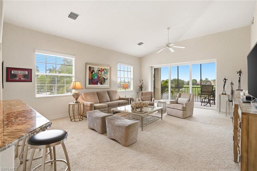 Welcome to Champions at Lely Resort—an exclusive enclave often regarded as one of Naples most refined hidden gems. From the moment you arrive, you are welcomed by a private entry foyer, where a beautiful staircase or your own personal elevator takes you to the main living space, setting the tone for the lifestyle that awaits. Encompassing 2,686 square feet, this exceptional residence lives offers the comfort and privacy of a single-family home. Kitchen, hallway and bathrooms with 18-inch tile, while neutral carpeting adds warmth and sound absorption in the living room and bedrooms. The thoughtfully designed split bedroom floor plan ensures both relaxation and privacy, featuring an oversized guest suite with a custom Murphy bed, a generous walk-in closet, and a full en suite bath with a tiled shower and polished chrome fixtures.

A light-filled dining room offers a serene and versatile space—ideal for a den, library, or home office. At the heart of the home, the kitchen is both lovely and functional, appointed with custom Cherry cabinetry, gleaming granite countertops, a spacious serving island, GE Cafe stainless steel appliances, and a charming breakfast area. All are perfectly positioned to capture sweeping views of the tranquil lake and manicured golf course beyond. The vaulted ceiling living room is designed for both relaxation and entertaining, seamlessly extending to a screened lanai where there are no other buildings in the side yard. Here, you can unwind while enjoying panoramic water and golf course views, all illuminated by Naples famous and breathtaking sunsets. The primary suite is a sanctuary, featuring an expansive walk-in closet, en suite bath complete with dual vanities, a dedicated makeup area, and a separate soaking tub and glass-enclosed shower.  Residents of Champions enjoy a peaceful, resort-style pool area and clubhouse, all while being just moments from Naples pristine beaches, upscale shopping, fine dining, and vibrant cultural events. Membership to The Players Club & Spa at Lely Resort is available, offering an enhanced lifestyle experience and is not  mandatory with this unit.