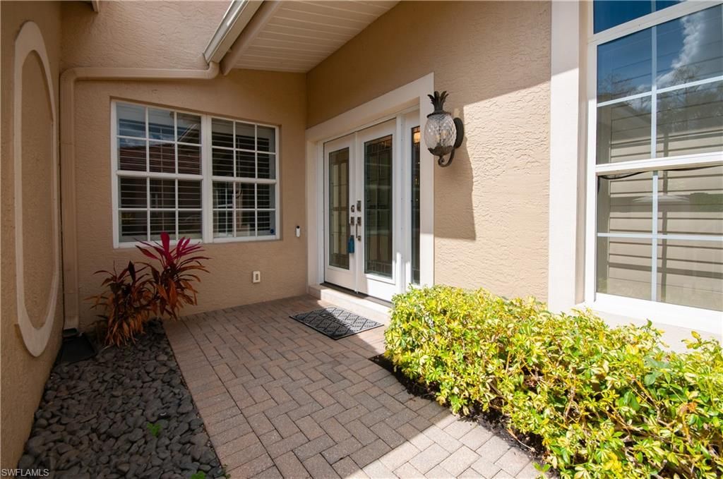 Photo of 5965 Ashford LN, NAPLES, FL 34110 (MLS # 226009803)